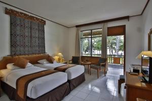 Letto o letti in una camera di Jayakarta Hotel Lombok