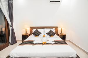 Postel nebo postele na pokoji v ubytování Dijumahrai Homestay
