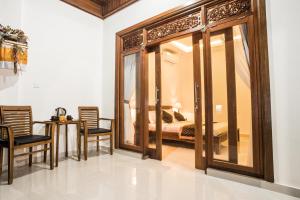 Posezení v ubytování Dijumahrai Homestay