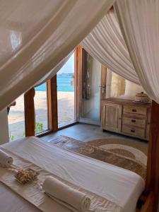 Voodi või voodid majutusasutuse Samura Maldives Guest House Thulusdhoo toas