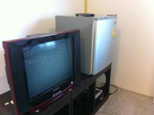 A television and/or entertainment center at Monkey Samui Hostel