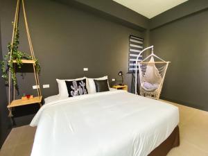 Postel nebo postele na pokoji v ubytování 禾旅宿Ho Hostel 墾丁夢幻島