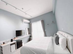 Postel nebo postele na pokoji v ubytování 禾旅宿Ho Hostel 墾丁夢幻島