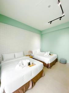 Postel nebo postele na pokoji v ubytování 禾旅宿Ho Hostel 墾丁夢幻島