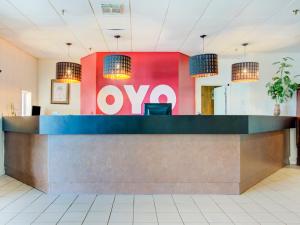 a lobby with a love sign on the wall at OYO Hotel Dundee By Crystal Lake in Dundee