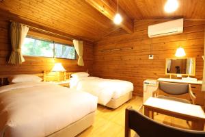 Postel nebo postele na pokoji v ubytování Karuizawa Prince Hotel East