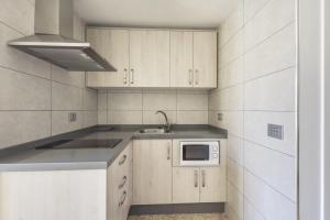 Kuchyň nebo kuchyňský kout v ubytování Apartamento Mar Rizada
