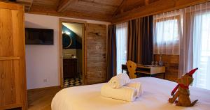 Postel nebo postele na pokoji v ubytování Le Vieux Chalet