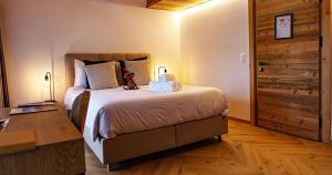 Postel nebo postele na pokoji v ubytování Le Vieux Chalet