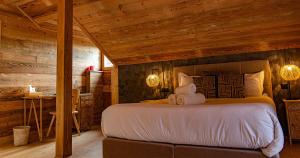 Postel nebo postele na pokoji v ubytování Le Vieux Chalet