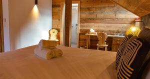 Postel nebo postele na pokoji v ubytování Le Vieux Chalet