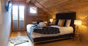 Postel nebo postele na pokoji v ubytování Le Vieux Chalet
