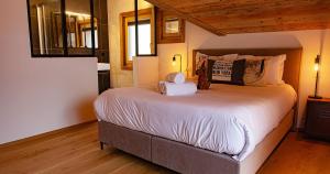 Postel nebo postele na pokoji v ubytování Le Vieux Chalet