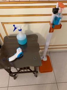 a table with a bottle of water and a toothbrush at Dowlat Villas Palace-The Heritage in Himatnagar