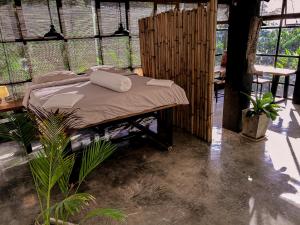 Postel nebo postele na pokoji v ubytování Oasis Koh Chang
