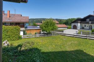 a view of a yard with a house at Haus Alpsee in Immenstadt im Allgäu