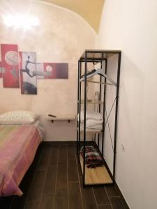 a room with a bunk bed and a shelf at Le antiche mura 2 in Sassari