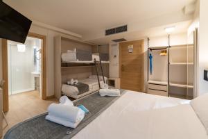 Postel nebo postele na pokoji v ubytování Atotxa Rooms