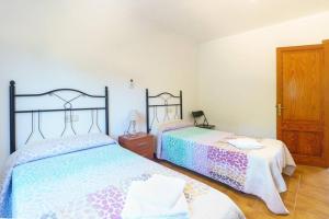 Ein Bett oder Betten in einem Zimmer der Unterkunft Villa Luis Vives By SunVillas Mallorca