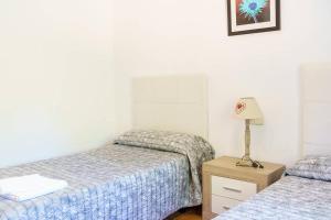 Ein Bett oder Betten in einem Zimmer der Unterkunft Villa Luis Vives By SunVillas Mallorca