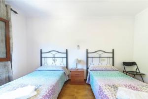 Ein Bett oder Betten in einem Zimmer der Unterkunft Villa Luis Vives By SunVillas Mallorca