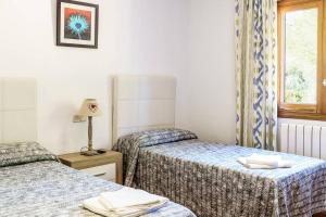 Ein Bett oder Betten in einem Zimmer der Unterkunft Villa Luis Vives By SunVillas Mallorca