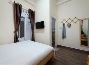 Postelja oz. postelje v sobi nastanitve Moc Thach Hostel Dalat
