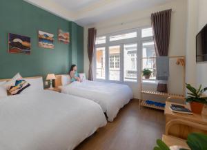 Postelja oz. postelje v sobi nastanitve Moc Thach Hostel Dalat