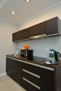 Kuchyň nebo kuchyňský kout v ubytování Apartamenty TOP Garbary