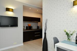 TV a/nebo společenská místnost v ubytování Apartamenty TOP Garbary