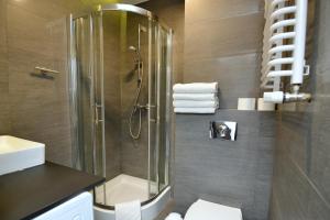 Koupelna v ubytování Apartamenty TOP Garbary + 29 fotografií