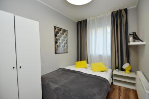 Postel nebo postele na pokoji v ubytování Apartamenty TOP Garbary