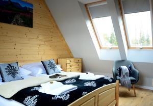 Posteľ alebo postele v izbe v ubytovaní Biathlon Park - Apartament VIP