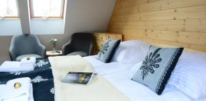 Posteľ alebo postele v izbe v ubytovaní Biathlon Park - Apartament VIP