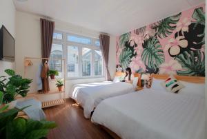 Postelja oz. postelje v sobi nastanitve Moc Thach Hostel Dalat