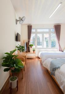 Postelja oz. postelje v sobi nastanitve Moc Thach Hostel Dalat