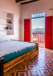 a bedroom with a bed with a view of the ocean at Dream Boathouse in Klima