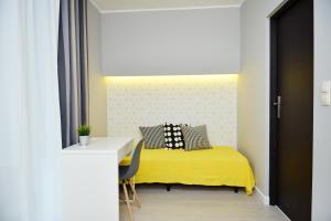 Postel nebo postele na pokoji v ubytování Apartamenty TOP Garbary