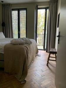 Postel nebo postele na pokoji v ubytování Parkhotel Abcoude