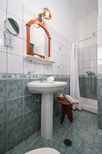 a bathroom with a sink and a shower at Apollon Hotel in Naxos Chora