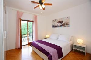 Postel nebo postele na pokoji v ubytování Apartments Omo 1