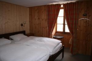 Postel nebo postele na pokoji v ubytování Hotel de la Sage