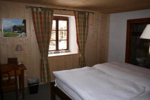 Postel nebo postele na pokoji v ubytování Hotel de la Sage