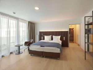 Säng eller sängar i ett rum på Aiden by Best Western Biberach