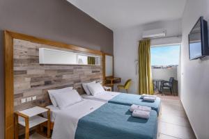 Postel nebo postele na pokoji v ubytování Vanisko Hotel