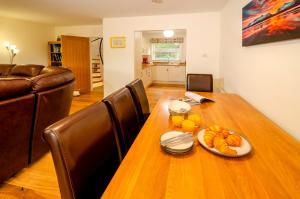 a dining room table with a plate of food on it at Quarry Bank in Chapel Stile