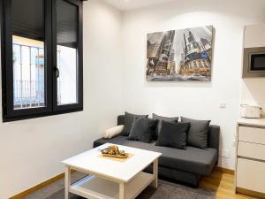 Posezení v ubytování INSIDEHOME Apartments - Dúplex de Javier + 9 fotografií