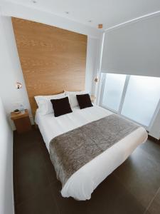 Cama o camas de una habitación en Salamanca Suites Libertad