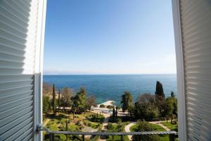 a view of the ocean from a window at Hostel Link in Lovran