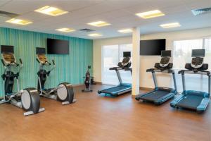 a gym with several tread machines in a room at Holiday Inn Express & Suites - Las Vegas - E Tropicana, an IHG Hotel in Las Vegas